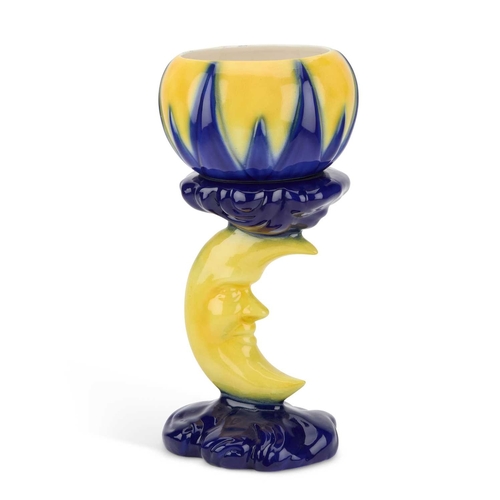 56 - A CONTEMPORARY JARDINIÈRE ON STAND glazed in blue and yellow mimicking sun-rays, raised on a moulded... 