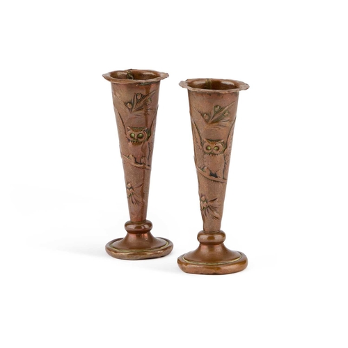 97 - A PAIR OF MINIATURE ARTS AND CRAFTS COPPER POSY VASES each chased with a perched owl with its wings ... 