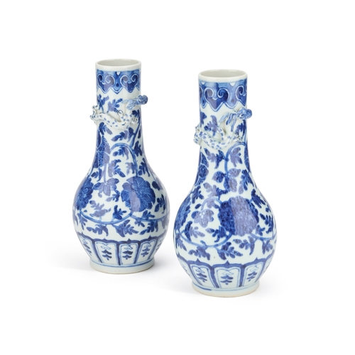 101 - A PAIR OF CHINESE BLUE AND WHITE VASES, PROBABLY 19TH CENTURY each painted with lotus flowers and ap... 