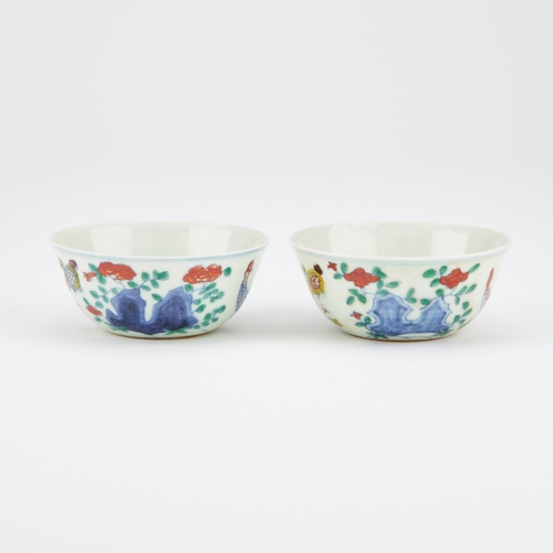 109 - A PAIR OF CHINESE DOUCAI 'CHICKEN' CUPS each bears an underglaze blue six-character mark in a double... 