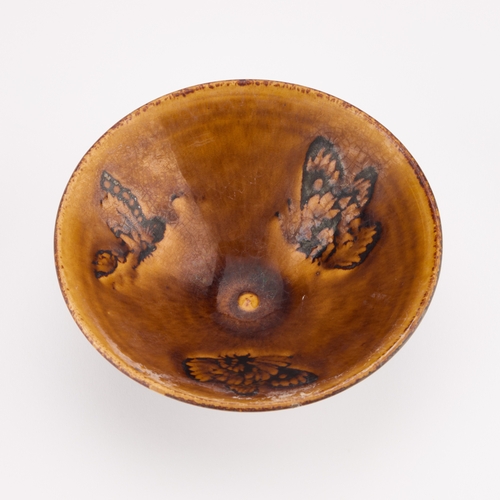 115 - A CHINESE STONEWARE 'BUTTERFLY' BOWL conical, the interior glazed with three butterflies. 15.5cm dia... 