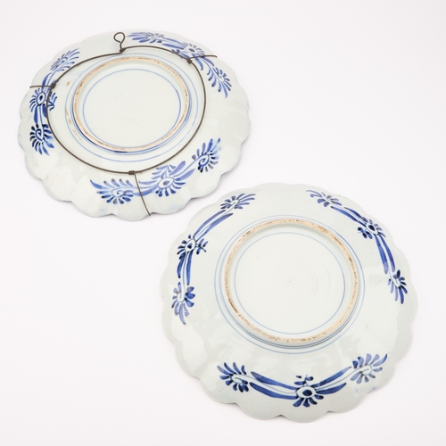 128 - TWO LATE 19TH CENTURY JAPANESE IMARI CHARGERS each with a scalloped rim. (2) 31.5cm diameter