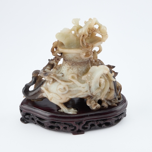 144 - A CHINESE BLACK AND WHITE JADE 'MYTHICAL BEAST' VASE AND COVER late Qing Dynasty/ Republic Period, t... 