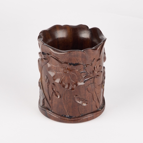 156 - A CHINESE HARDWOOD BRUSH POT, BITONG carved with foliage. 13.5cm high