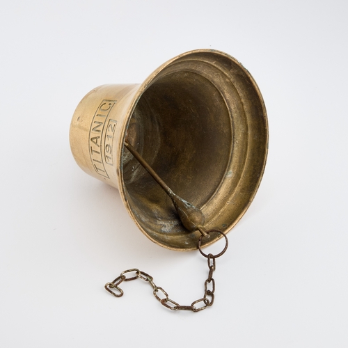 166 - A BRASS SHIP'S BELL bears the inscription TITANIC and the date 1912, with a wall-mounting bracket. 2... 
