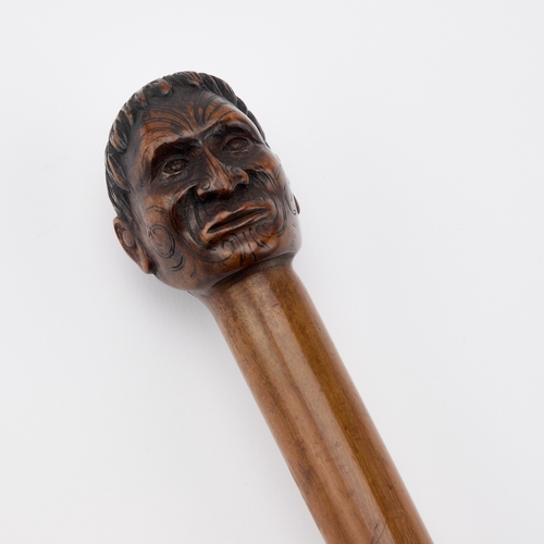 2 - A NEW ZEALAND WALKING CANE, LATE 19TH OR EARLY 20TH CENTURY the terminal finely carved as the tattoo... 