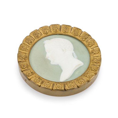 41 - A BISCUIT PORCELAIN PORTRAIT MEDALLION DEPICTING NAPOLEON, 19TH CENTURY in a gilt-metal frame with c... 