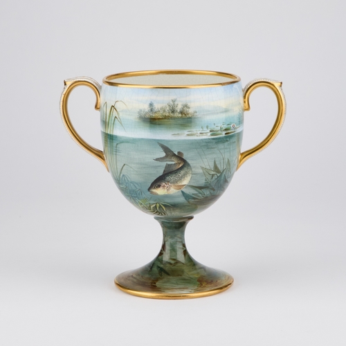 48 - A 19TH CENTURY PAINTED POTTERY TWO-HANDLED CUP the ovoid bowl painted with fish, the rims and handle... 