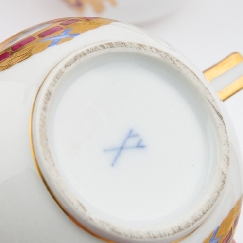 52 - A GERMAN PORCELAIN TEA AND CHOCOLATE SERVICE comprising a teapot, chocolate pot, cream jug, sucrier ... 