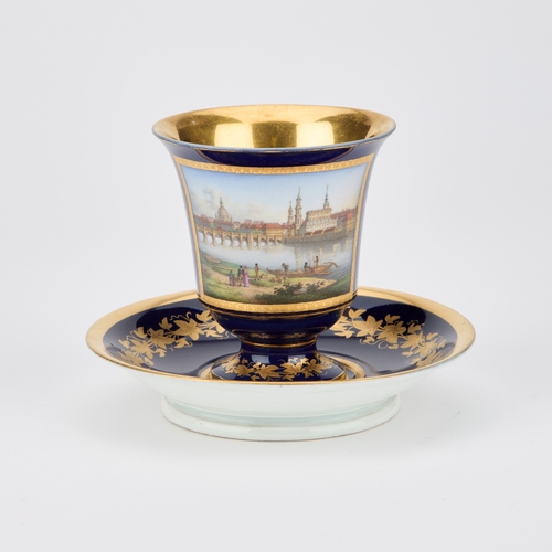 54 - A GERMAN TOPOGRAPHICAL CUP AND SAUCER the cup with a view of Dresden from the bank of the Elbe below... 