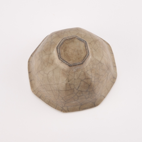 72 - A CHINESE CRACKLE-GLAZE CUP octagonal. 9cm diameter