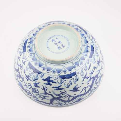 83 - A LARGE CHINESE BLUE AND WHITE BOWL bears Jiajing mark and possibly of the period, the exterior pain... 