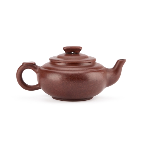 91 - A CHINESE YIXING TEAPOT bears an impressed mark. 20cm long