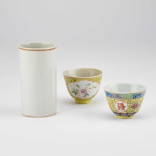 103 - A CHINESE FAMILLE ROSE CYLINDRICAL VASE AND TWO YELLOW-GROUND BOWLS (3) Vase 12cm high