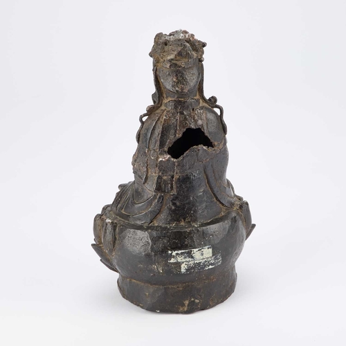 123 - A CHINESE BRONZE BUDDHA, MING seated on a lotus base. 26cm high