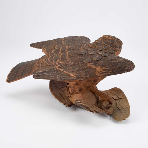 130 - A FINE JAPANESE CARVED WOOD OKIMONO Meiji period (1868-1912), depicting two fighting hawks, the feat... 