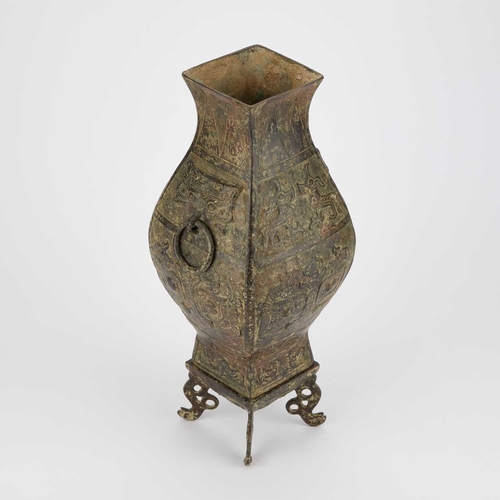 134 - A CHINESE BRONZE VASE in Archaistic style, on a stand. (2) 35.5cm high