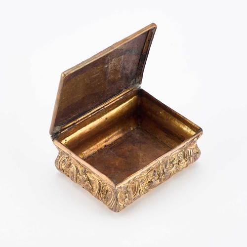 165 - AN 18TH CENTURY GILT-METAL SNUFF BOX the hinged cover cast with figures. 8cm long