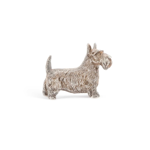 300 - AN ELIZABETH II CAST SILVER MODEL OF A SCOTTISH TERRIER by B S E Products, London 1985. 9cm long, 7.... 