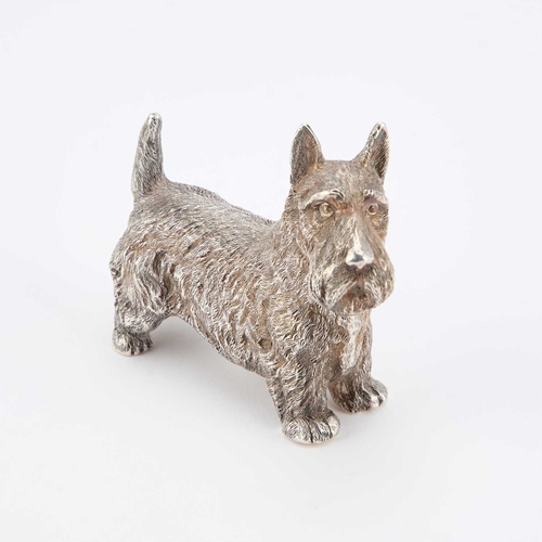 300 - AN ELIZABETH II CAST SILVER MODEL OF A SCOTTISH TERRIER by B S E Products, London 1985. 9cm long, 7.... 