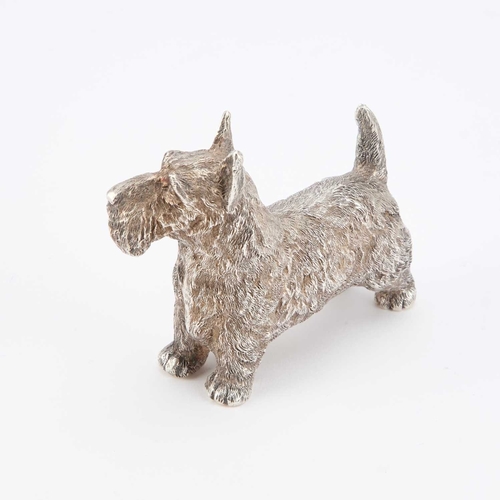 300 - AN ELIZABETH II CAST SILVER MODEL OF A SCOTTISH TERRIER by B S E Products, London 1985. 9cm long, 7.... 