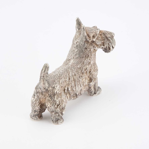 300 - AN ELIZABETH II CAST SILVER MODEL OF A SCOTTISH TERRIER by B S E Products, London 1985. 9cm long, 7.... 