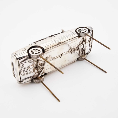 310 - AN ELIZABETH II SILVER MODEL OF A FORD SCORPIO CAR by Garrard & Co Ltd, London 1989, on a wooden... 