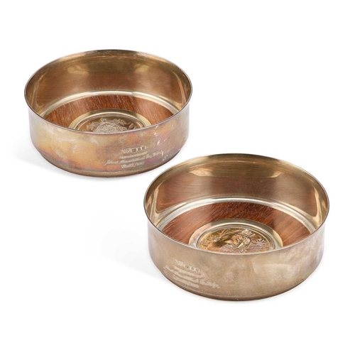 318 - CHURCHILL MEMORABILIA: A PAIR OF PARCEL-GILT SILVER CHURCHILL CENTENARY COASTERS by Garrard & Co... 