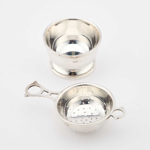 321 - A GEORGE VI SILVER TEA STRAINER AND BOWL by Mappin & Webb Ltd, Birmingham 1944. (2) 10.3cm long,... 