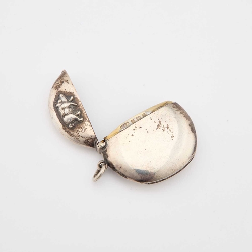 331 - AN EDWARDIAN SILVER VESTA CASE by Horton & Allday, Birmingham 1905, circular, the hinged cover a... 