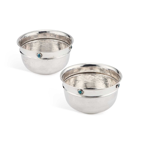 350 - LIBERTY & CO: A PAIR OF ARTS AND CRAFTS SILVER BOWLS by Liberty & Co Ltd, Birmingham 1910, circu... 