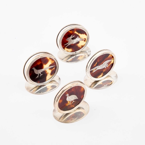 377 - A SET OF FOUR GEORGE V SILVER AND TORTOISESHELL MENU HOLDERS by William Comyns & Sons, London 19... 