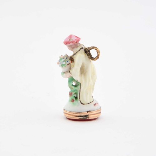 41 - A FINE CHELSEA PORCELAIN FIGURAL SEAL inscribed MA BELLE LES AURA. 3.6cm high