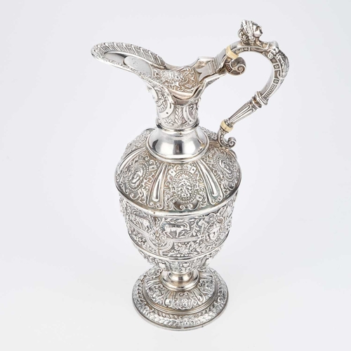 410 - § A VICTORIAN SILVER CLARET JUG by James Dixon & Son, Sheffield 1900, after Cellini, the flared ... 