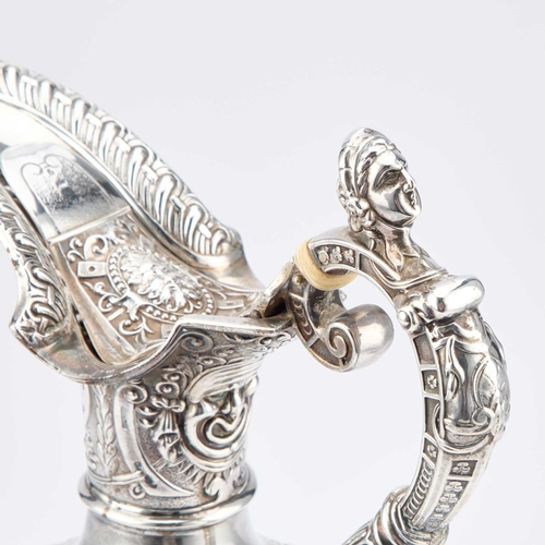 410 - § A VICTORIAN SILVER CLARET JUG by James Dixon & Son, Sheffield 1900, after Cellini, the flared ... 