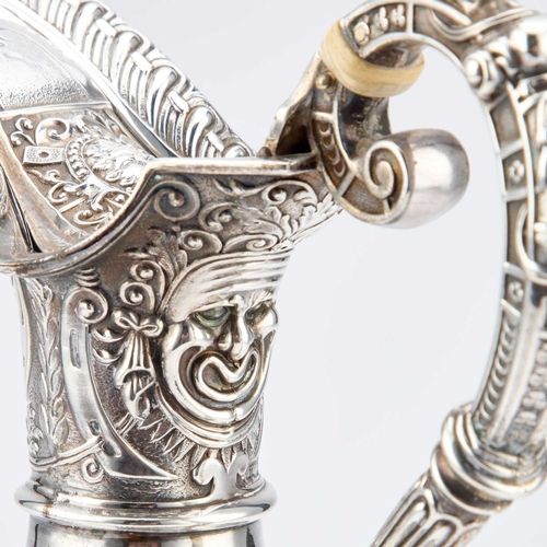 410 - § A VICTORIAN SILVER CLARET JUG by James Dixon & Son, Sheffield 1900, after Cellini, the flared ... 