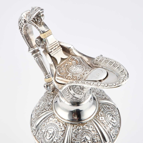 410 - § A VICTORIAN SILVER CLARET JUG by James Dixon & Son, Sheffield 1900, after Cellini, the flared ... 