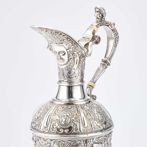 410 - § A VICTORIAN SILVER CLARET JUG by James Dixon & Son, Sheffield 1900, after Cellini, the flared ... 