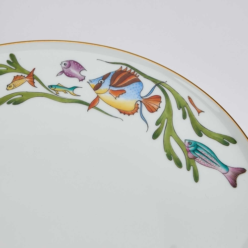 52 - A HEINRICH FISH PATTERN DINNER SERVICE comprising twelve dinner plates, an oval serving dish, and a ... 