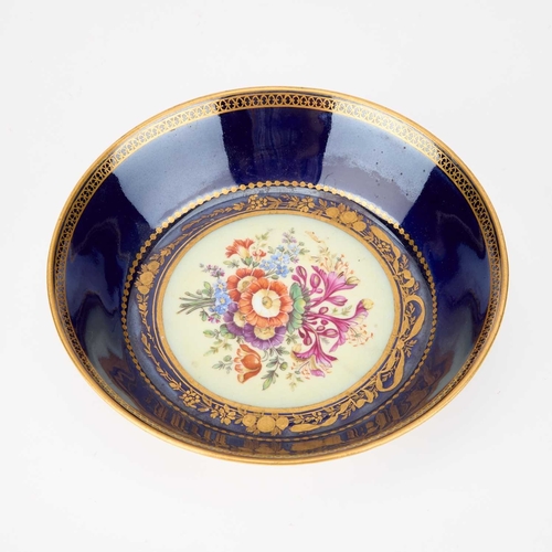 54 - A MEISSEN CABINET CUP AND SAUCER, 19TH CENTURY each painted with a floral spray and with gilt border... 