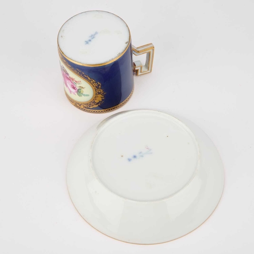 54 - A MEISSEN CABINET CUP AND SAUCER, 19TH CENTURY each painted with a floral spray and with gilt border... 