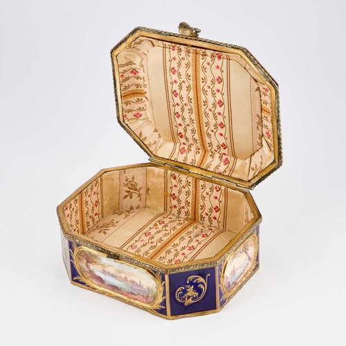 55 - A 19TH CENTURY GILT-METAL MOUNTED SÈVRES STYLE CASKET rectangular with canted corners, painted with ... 