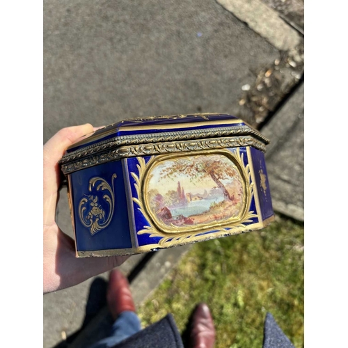 55 - A 19TH CENTURY GILT-METAL MOUNTED SÈVRES STYLE CASKET rectangular with canted corners, painted with ... 