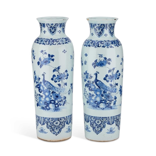 56 - A PAIR OF DUTCH FAIENCE CYLINDRICAL VASES (ROLWAGEN) the sleeve vases blue painted with flying geese... 