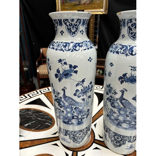 56 - A PAIR OF DUTCH FAIENCE CYLINDRICAL VASES (ROLWAGEN) the sleeve vases blue painted with flying geese... 