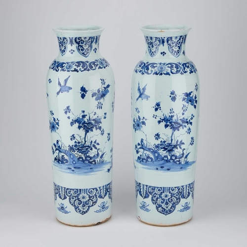 56 - A PAIR OF DUTCH FAIENCE CYLINDRICAL VASES (ROLWAGEN) the sleeve vases blue painted with flying geese... 