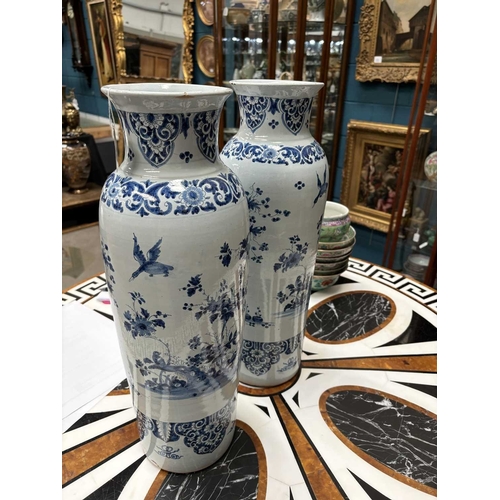 56 - A PAIR OF DUTCH FAIENCE CYLINDRICAL VASES (ROLWAGEN) the sleeve vases blue painted with flying geese... 