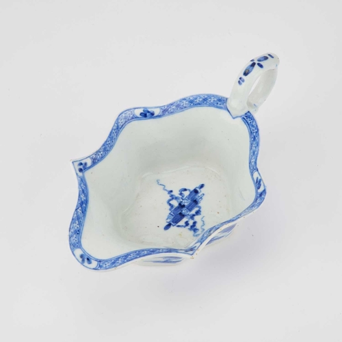 57 - A BOW BLUE AND WHITE SAUCEBOAT, CIRCA 1752-53 of Chinese flat-bottomed leaf shape, decorated in brig... 