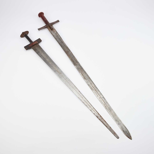 7 - TWO TAKOUBA WITH SCABBARDS each with a tapering blade, one with a pair of crescent moons to either s... 