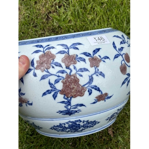 76 - A LARGE CHINESE UNDERGLAZE-BLUE AND COPPER-RED CENSER circular, painted with a Key pattern border ar... 